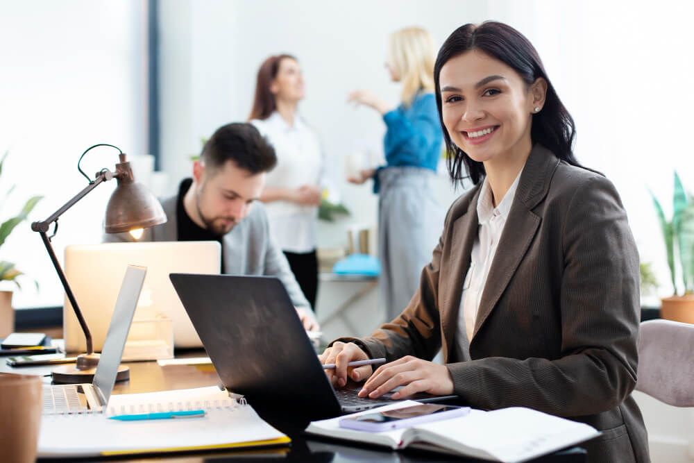 Offshore accounting professional working with team in modern office