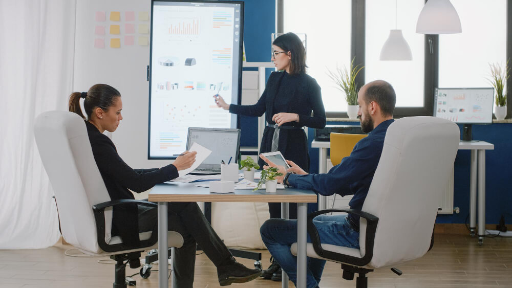 Business team reviewing financial analytics during an office strategy meeting